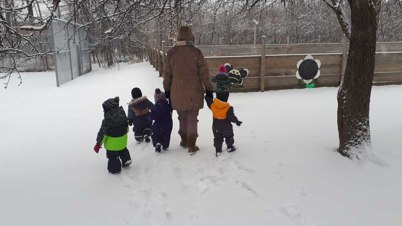 Toddlers walking in snow