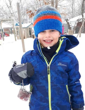 Child with bird feeder